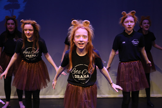 Girls with lion ear headset in drama show