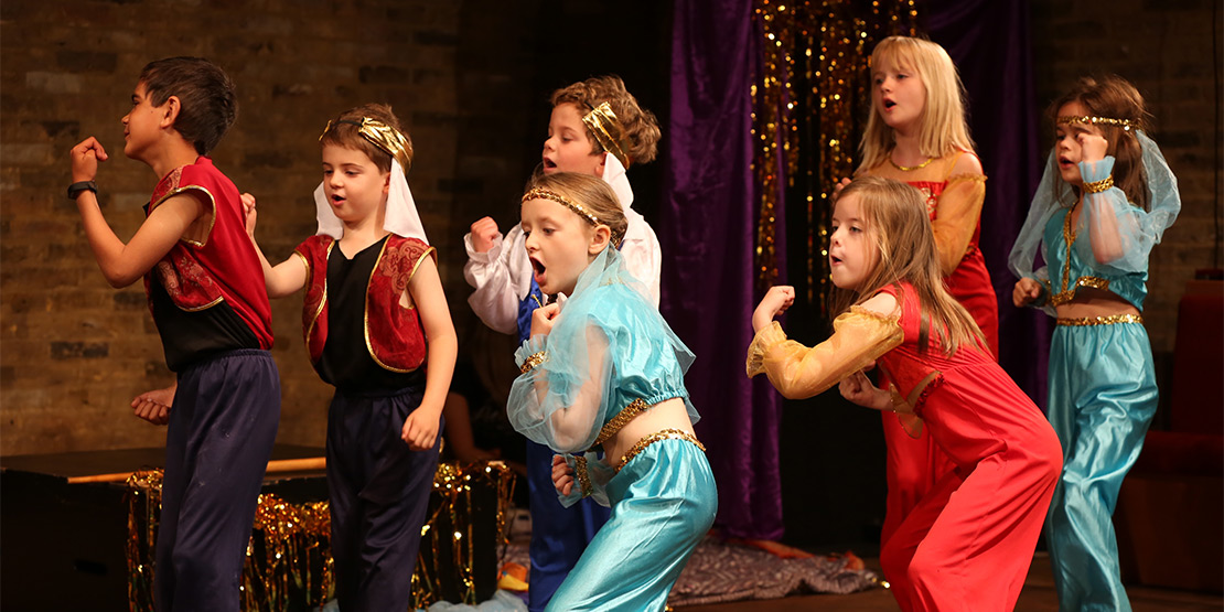 Group Of Children Performing Aladdin